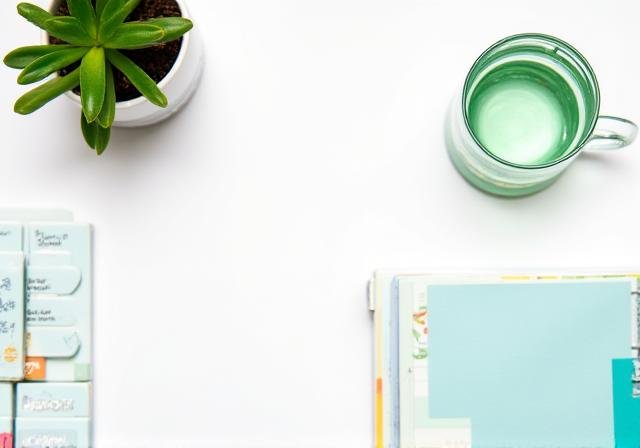 A serene morning setup with a planner and coffee